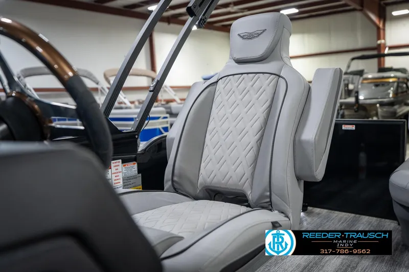 Slide: The Image of Close-up of 2026 Bennington 26 MSB steering wheel with Reeder-Trausch Marine logo. - 40