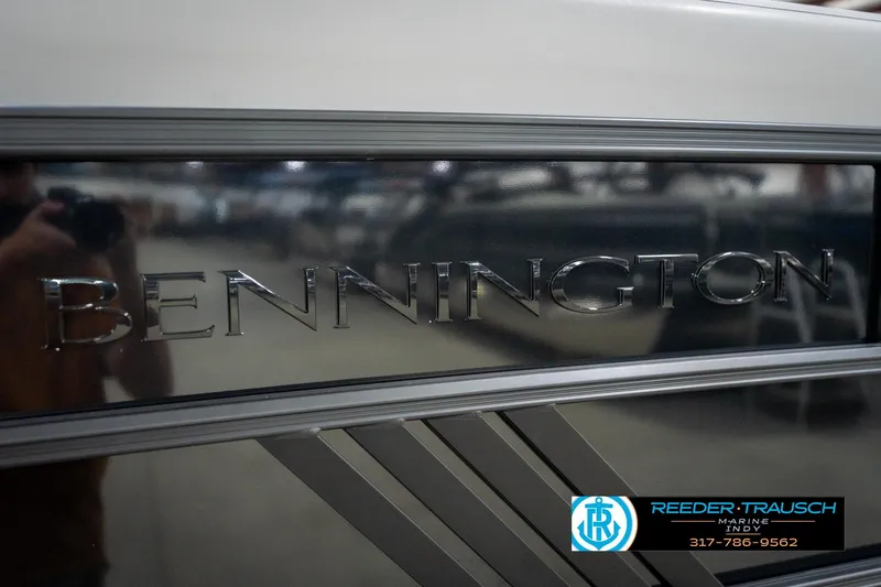 Slide: The Image of 2026 Bennington 26 MSB boat emblem with Reeder-Trausch Marine logo and contact information. - 52