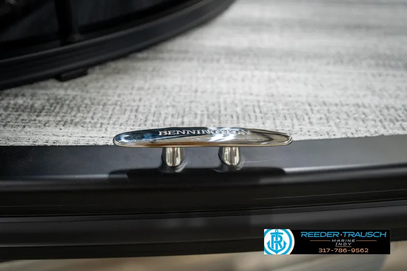 Slide: The Image of 2026 Bennington 26 MSB pontoon boat with sleek design and modern features in showroom. - 54