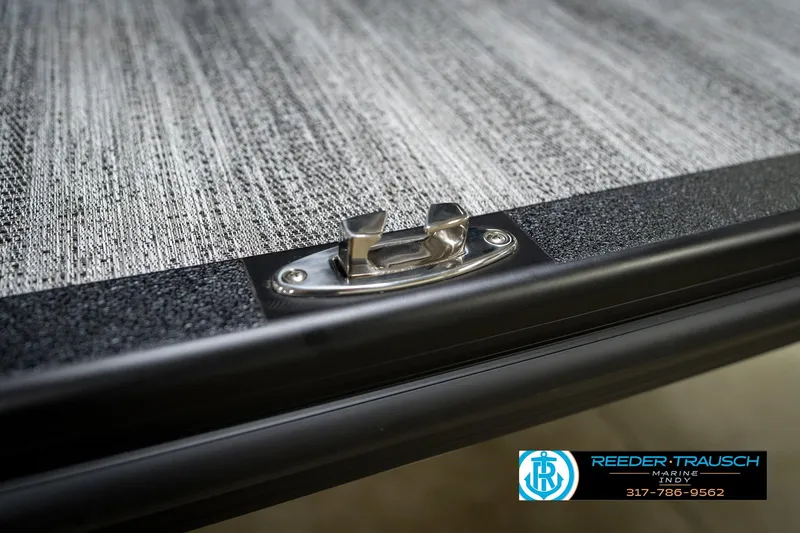 Slide: The Image of 2026 Bennington 26 MSB boat deck detail with textured surface and metal fixture. - 56