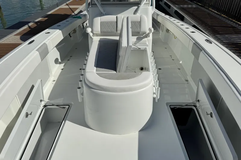 Slide: The Image of 2018 Freeman 42 LR boat interior with seating and storage compartments. - 11