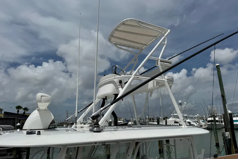 Slide: The Image of 2018 Freeman 42 boat with tower and radar, docked under cloudy sky. - 15