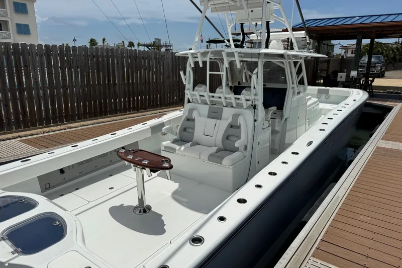Slide: The Image of 2018 Freeman 42 boat docked, featuring spacious seating and fishing amenities. - 30