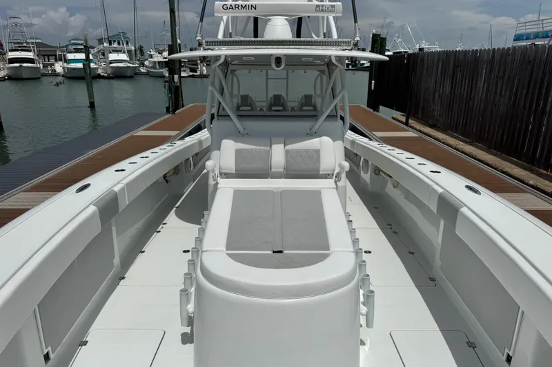 Slide: The Image of 2018 Freeman 42 boat docked, featuring spacious deck and modern design. - 8