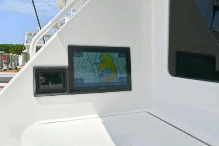 Slide: The Image of Luxurious kitchen interior of 2003 Viking 48 Convertible yacht with wooden cabinets and sink. - 19