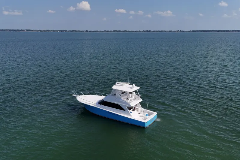 Slide: The Image of Luxurious interior of a 2003 Viking 48 Convertible yacht with elegant seating and modern amenities. - 2