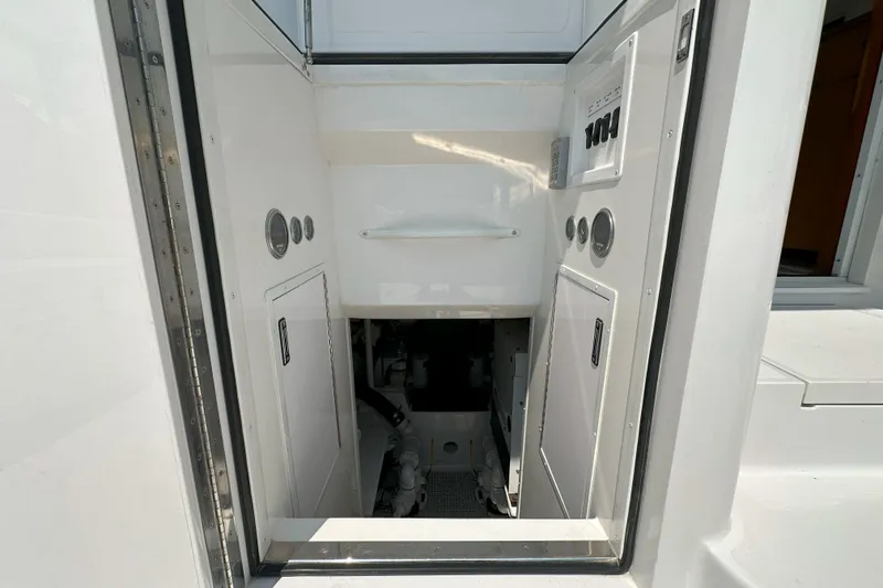 Slide: The Image of Interior of 2003 Viking 48 Convertible yacht with TV, seating, and decor. - 21