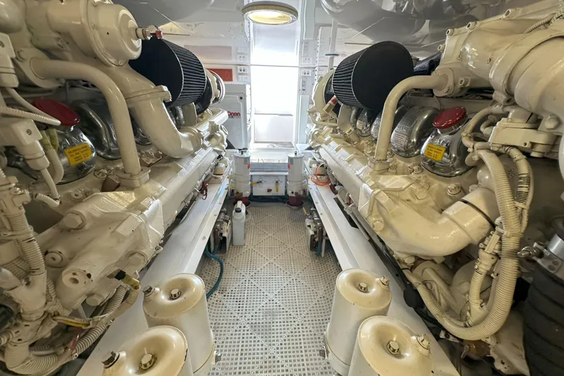 Slide: The Image of Bathroom interior of 2003 Viking 48 Convertible yacht, featuring shower, toilet, and towel rack. - 28