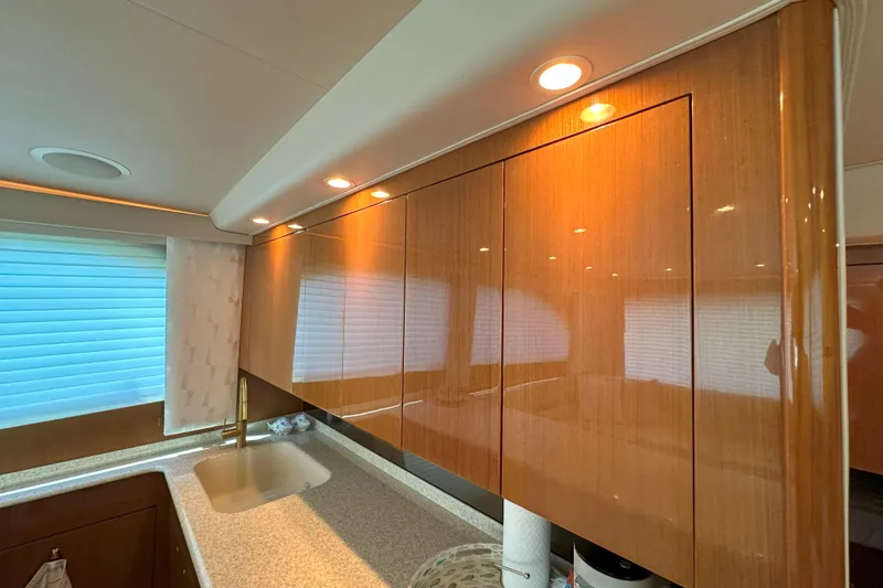 Slide: The Image of Engine room of a 2003 Viking 48 Convertible yacht, showcasing dual engines and piping. - 38