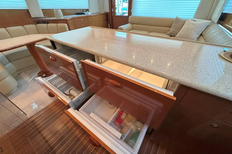 Slide: The Image of Engine room of 2003 Viking 48 Convertible yacht, showcasing machinery and fuel filters. - 39