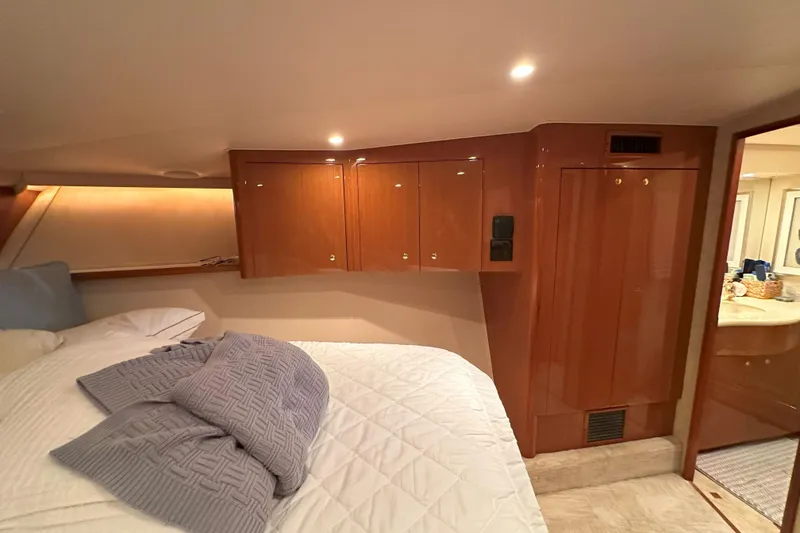 Slide: The Image of Electrical panel inside 2003 Viking 48 Convertible yacht, showcasing control switches and meters. - 45