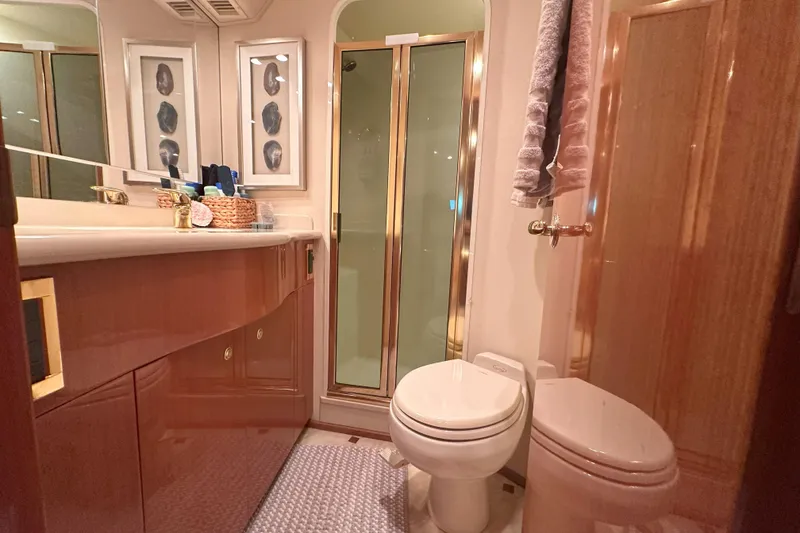 Slide: The Image of Engine compartment of a 2003 Viking 48 Convertible boat, showcasing wiring and components. - 46