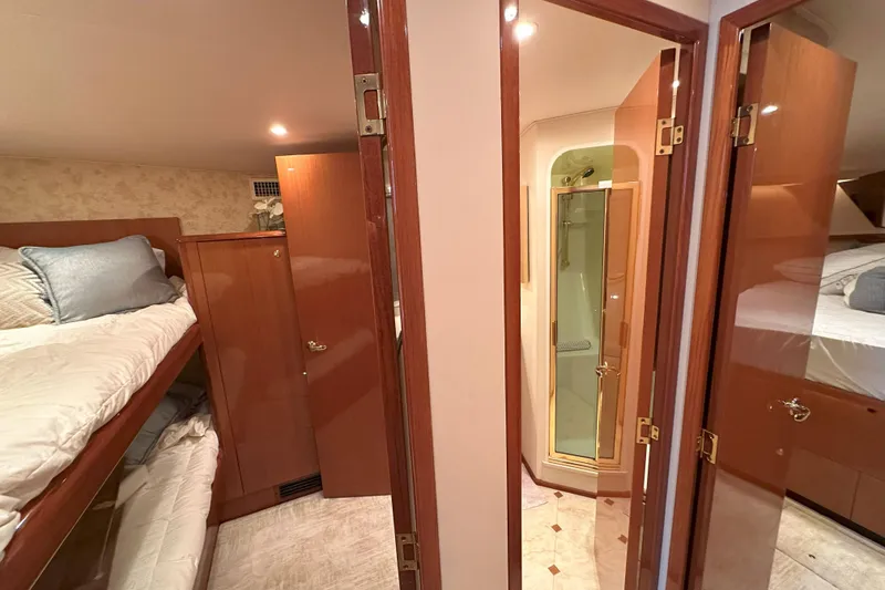 Slide: The Image of Engine compartment of 2003 Viking 48 Convertible boat, showing wiring and hoses. - 48