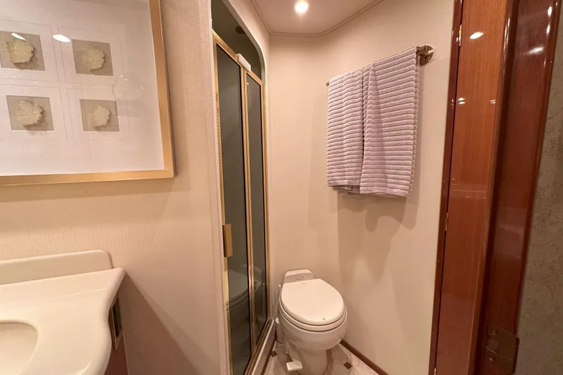 Slide: The Image of Engine room wiring and components of a 2003 Viking 48 Convertible boat. - 50