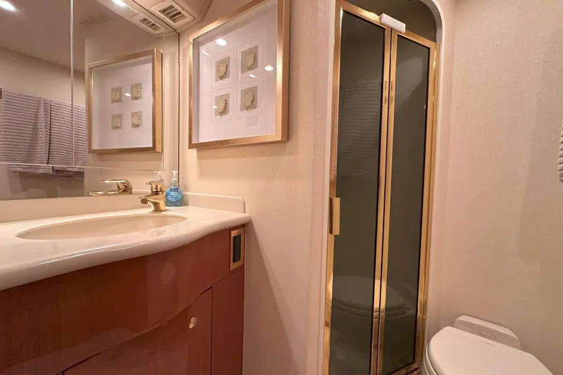 Slide: The Image of Electrical system inside a 2003 Viking 48 Convertible yacht, showcasing wiring and components. - 51