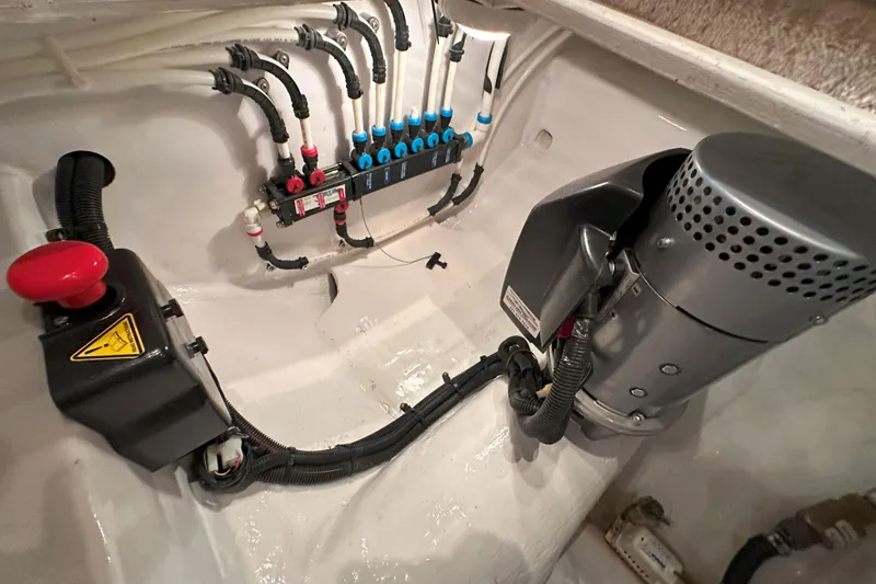 Slide: The Image of Electrical panel of a 2003 Viking 48 Convertible yacht, showcasing wiring and circuit breakers. - 52