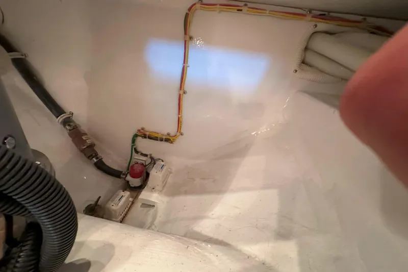 Slide: The Image of 2003 Viking 48 Convertible yacht on open sea under clear sky. - 54