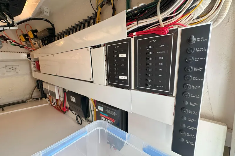 Slide: The Image of 2003 Viking 48 Convertible yacht on open sea under clear sky. - 63