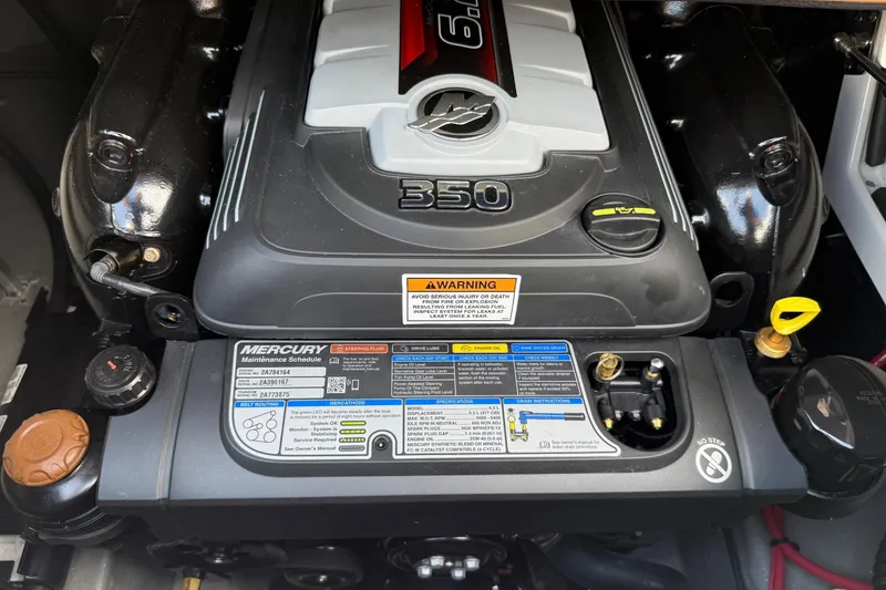 Slide: The Image of Engine of 2024 Crownline Eclipse E235 boat, featuring Mercury 350 with maintenance instructions. - 6