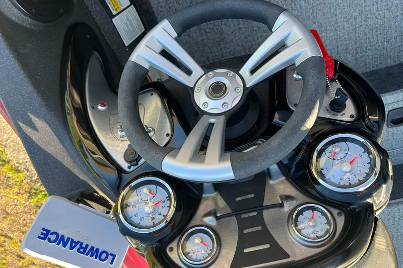 Slide: The Image of Steering console of 2021 Tracker Pro Team 175 TXW Tournament Edition boat with gauges and Lowrance device. - 19