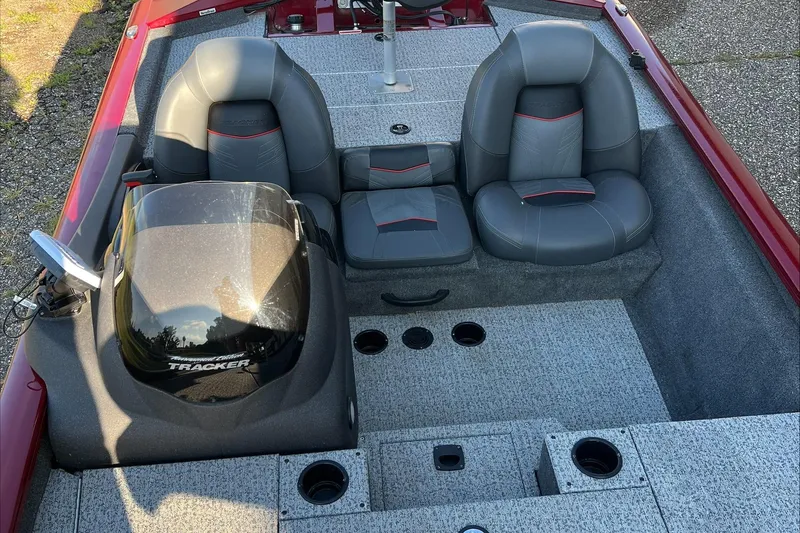 Slide: The Image of 2021 Tracker Pro Team 175 TXW Tournament Edition boat interior with gray seating and console. - 6