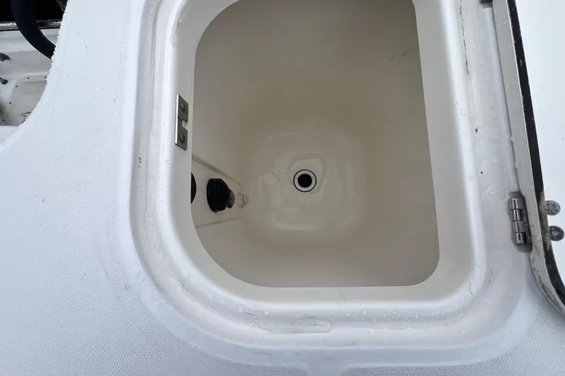 Slide: The Image of Open storage compartment on 2005 Boston Whaler 305 Conquest boat. - 15