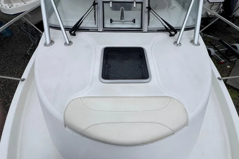 Slide: The Image of 2005 Boston Whaler 305 Conquest boat deck with hatch and seating area. - 22