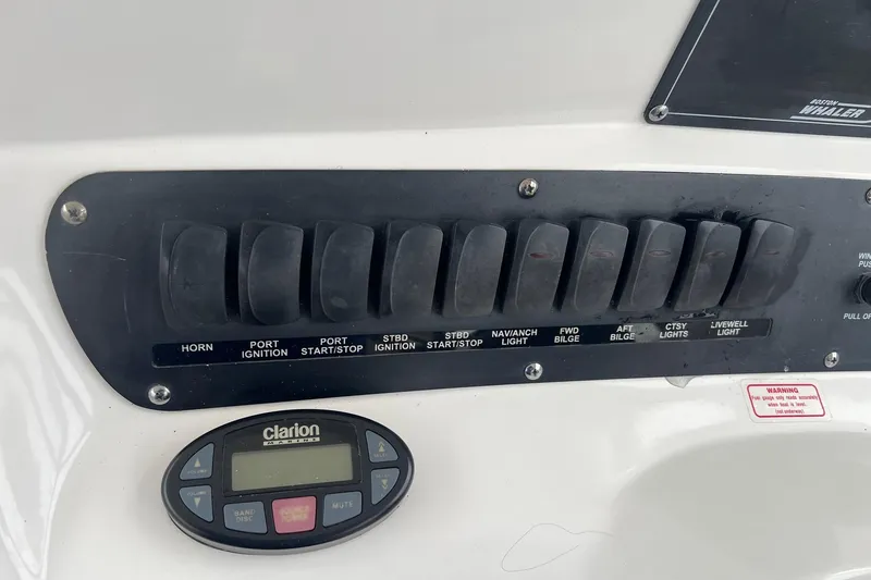 Slide: The Image of Control panel of a 2005 Boston Whaler 305 Conquest boat with Clarion audio system. - 29