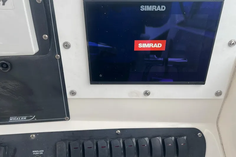 Slide: The Image of Control panel of a 2005 Boston Whaler 305 Conquest with Simrad display. - 31