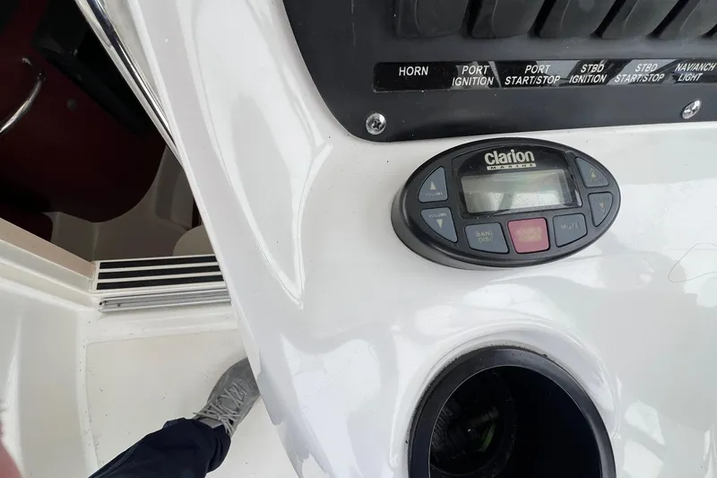 Slide: The Image of 2005 Boston Whaler 305 Conquest dashboard with Clarion marine audio system. - 33
