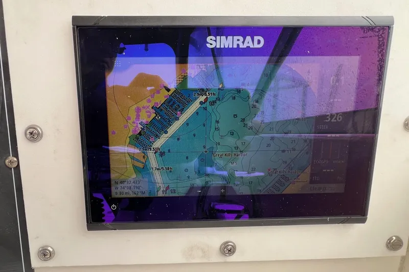 Slide: The Image of Simrad navigation display on 2005 Boston Whaler 305 Conquest boat, showing Great Kills Harbor map. - 35