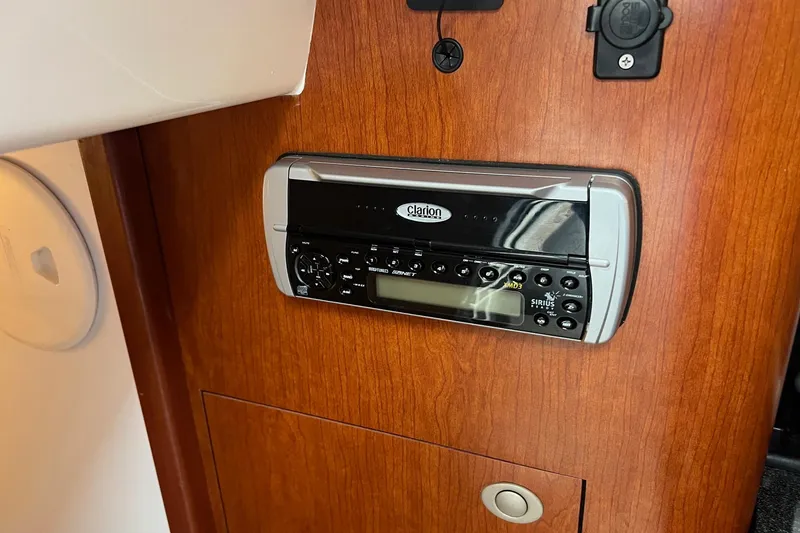 Slide: The Image of Clarion stereo system on 2005 Boston Whaler 305 Conquest boat interior. - 42