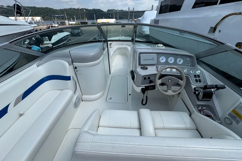 Slide: The Image of 2001 Formula 280 Bowrider boat interior with white seating and blue accents. - 10