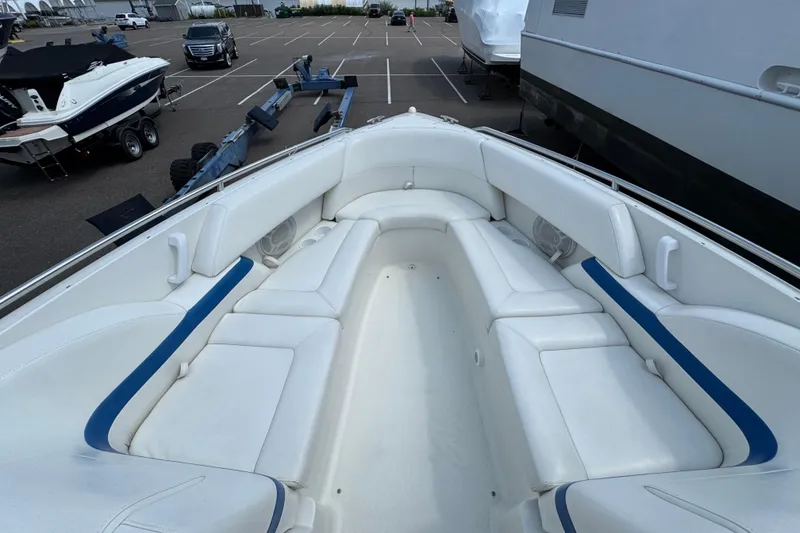 Slide: The Image of Interior view of a 2001 Formula 280 Bowrider boat, featuring storage compartments. - 13