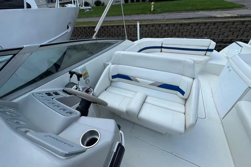 Slide: The Image of 2001 Formula 280 Bowrider boat interior with white seating and blue accents. - 15