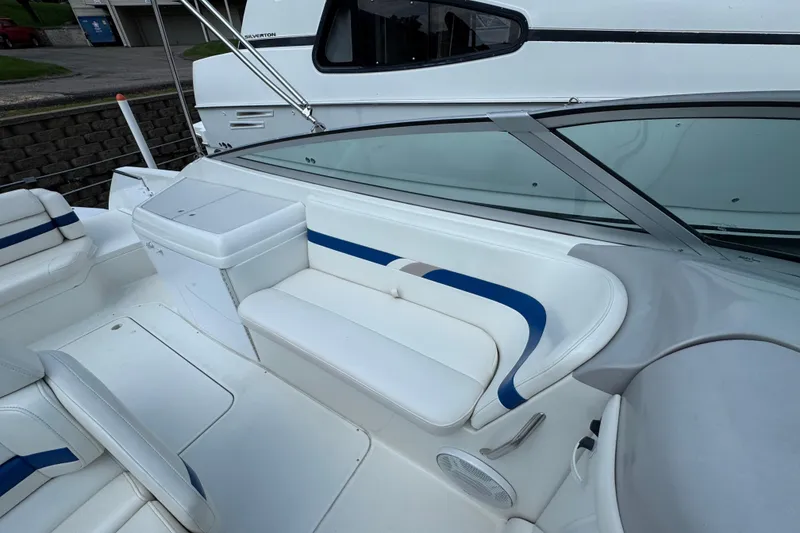 Slide: The Image of 2001 Formula 280 Bowrider interior with white and blue seating, open deck layout. - 16