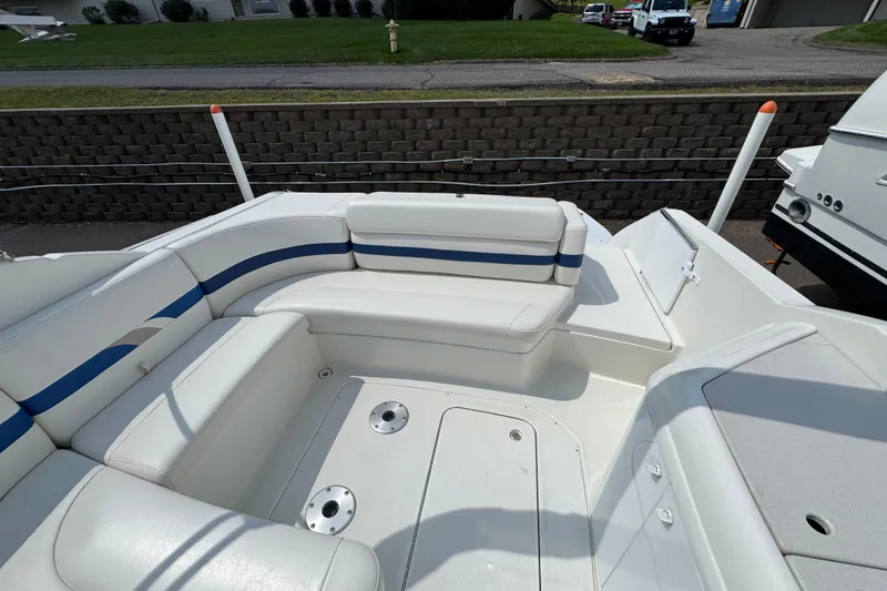 Slide: The Image of 2001 Formula 280 Bowrider interior with white seating and steering console. - 17