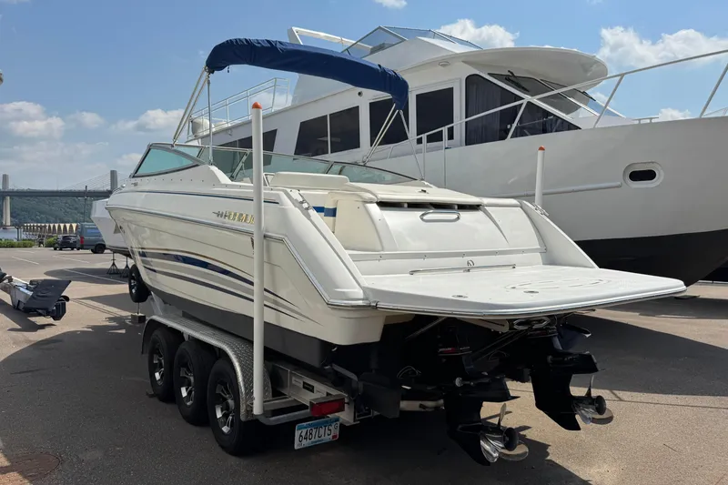 Slide: The Image of 2001 Formula 280 Bowrider boat on trailer under blue sky. - 2
