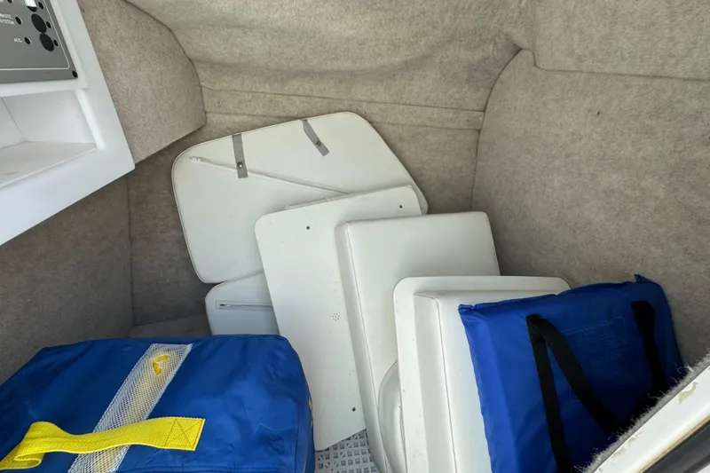 Slide: The Image of Interior of 2001 Formula 280 Bowrider boat with control panel and storage area. - 29