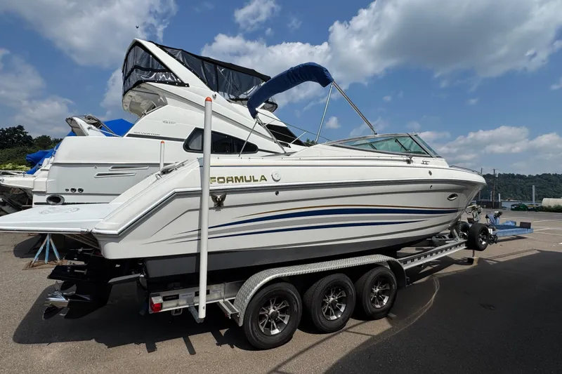 Slide: The Image of 2001 Formula 280 Bowrider boat for sale on trailer, parked outdoors. - 3