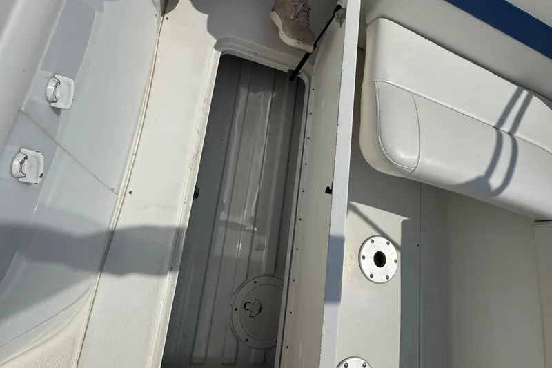 Slide: The Image of Interior of a 2001 Formula 280 Bowrider boat showing control panel and storage. - 30