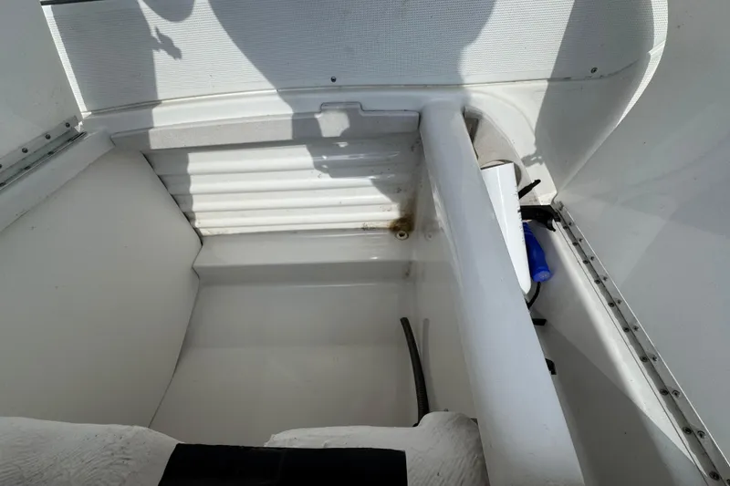 Slide: The Image of Interior storage of 2001 Formula 280 Bowrider with cushions and blue bags. - 31