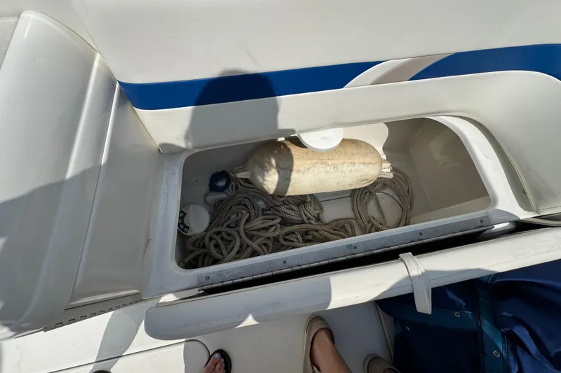 Slide: The Image of Storage compartment of a 2001 Formula 280 Bowrider with metal poles and fittings. - 34