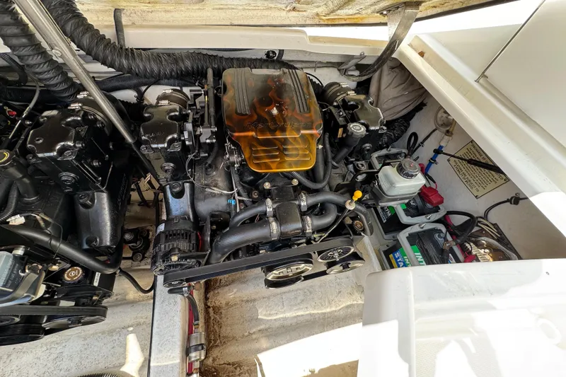 Slide: The Image of Engine compartment of a 2001 Formula 280 Bowrider boat, showcasing dual engines. - 37