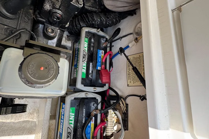 Slide: The Image of Engine compartment of a 2001 Formula 280 Bowrider boat, showcasing detailed mechanical components. - 38