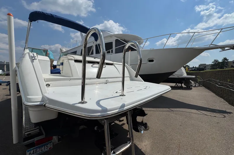 Slide: The Image of 2001 Formula 280 Bowrider boat on trailer under blue sky. - 5