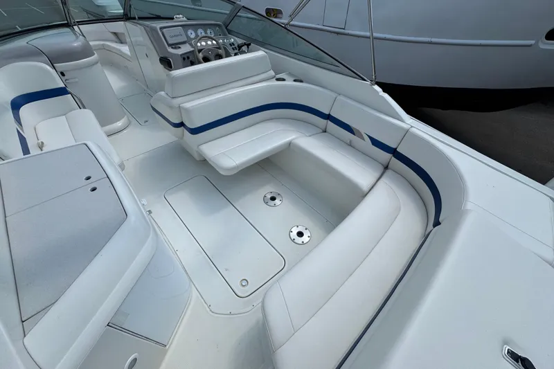 Slide: The Image of 2001 Formula 280 Bowrider boat deck, viewed from above, near a stone wall. - 9