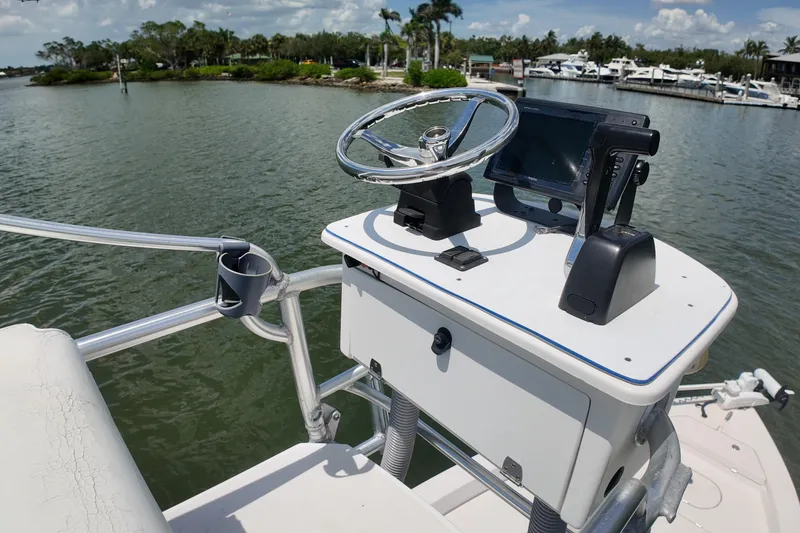 Slide: The Image of 2006 Pathfinder 2200 Tournament Edition boat console with steering wheel and navigation equipment. - 11