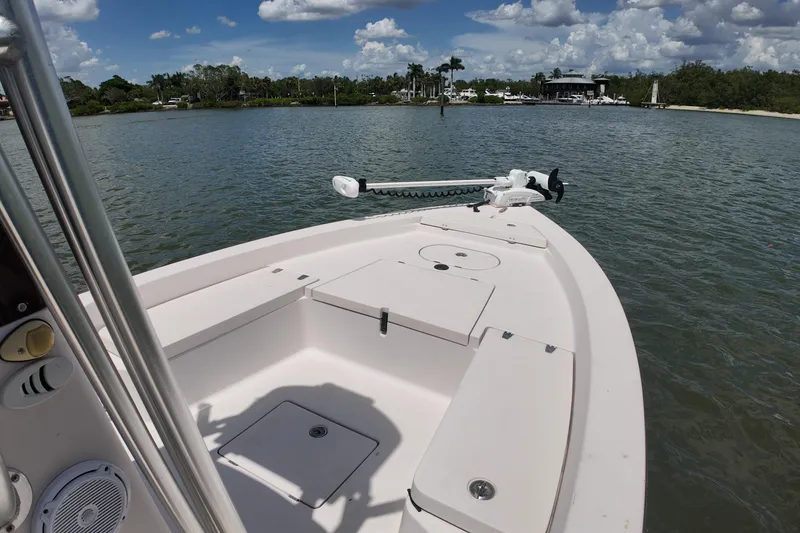 Slide: The Image of 2006 Pathfinder 2200 Tournament Edition boat on calm water under a partly cloudy sky. - 15