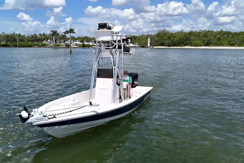 Slide: The Image of 2006 Pathfinder 2200 Tournament Edition boat on calm water under a cloudy sky. - 3